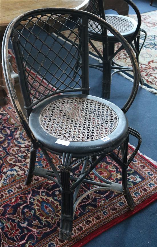 A set of four bamboo and rattan café chairs